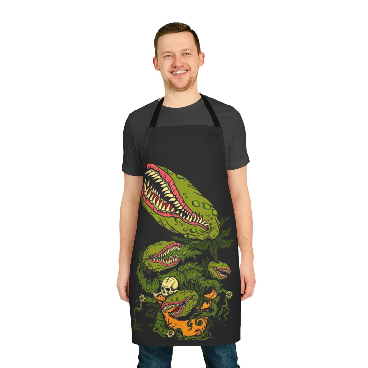 Apron featuring a detailed illustration of a venus fly trap plant in a cartoonish horror style, designed by artist Mike Zug.