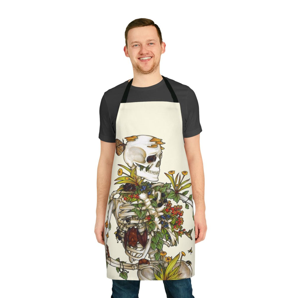 Apron featuring a botanical skeleton art design with bones, plants, and flowers