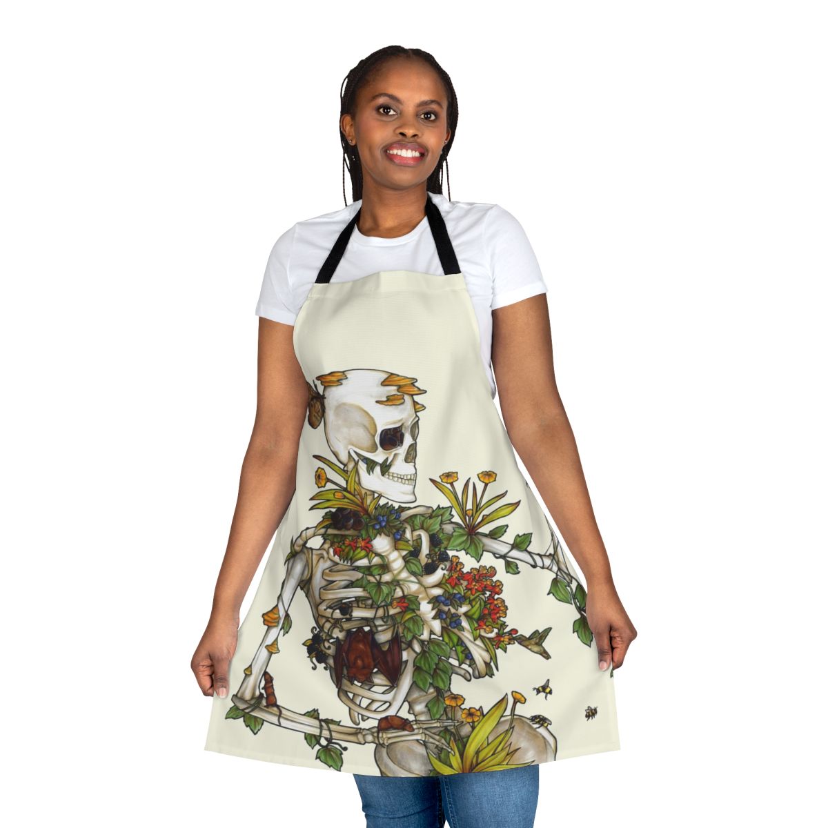 Apron featuring a botanical skeleton art design with bones, plants, and flowers