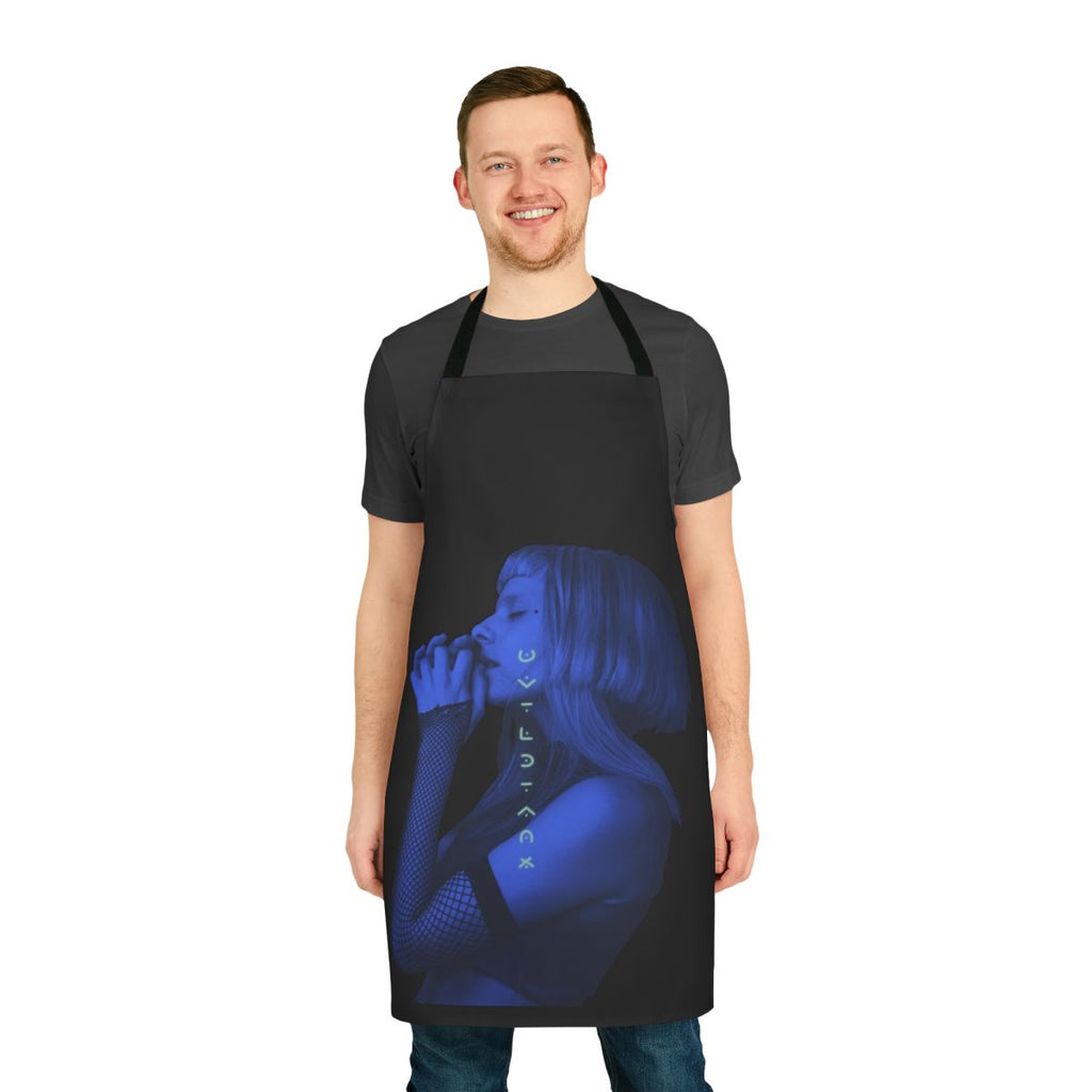 A nature-inspired apron featuring a botanical The Seed design by artist Aurora Aksnes