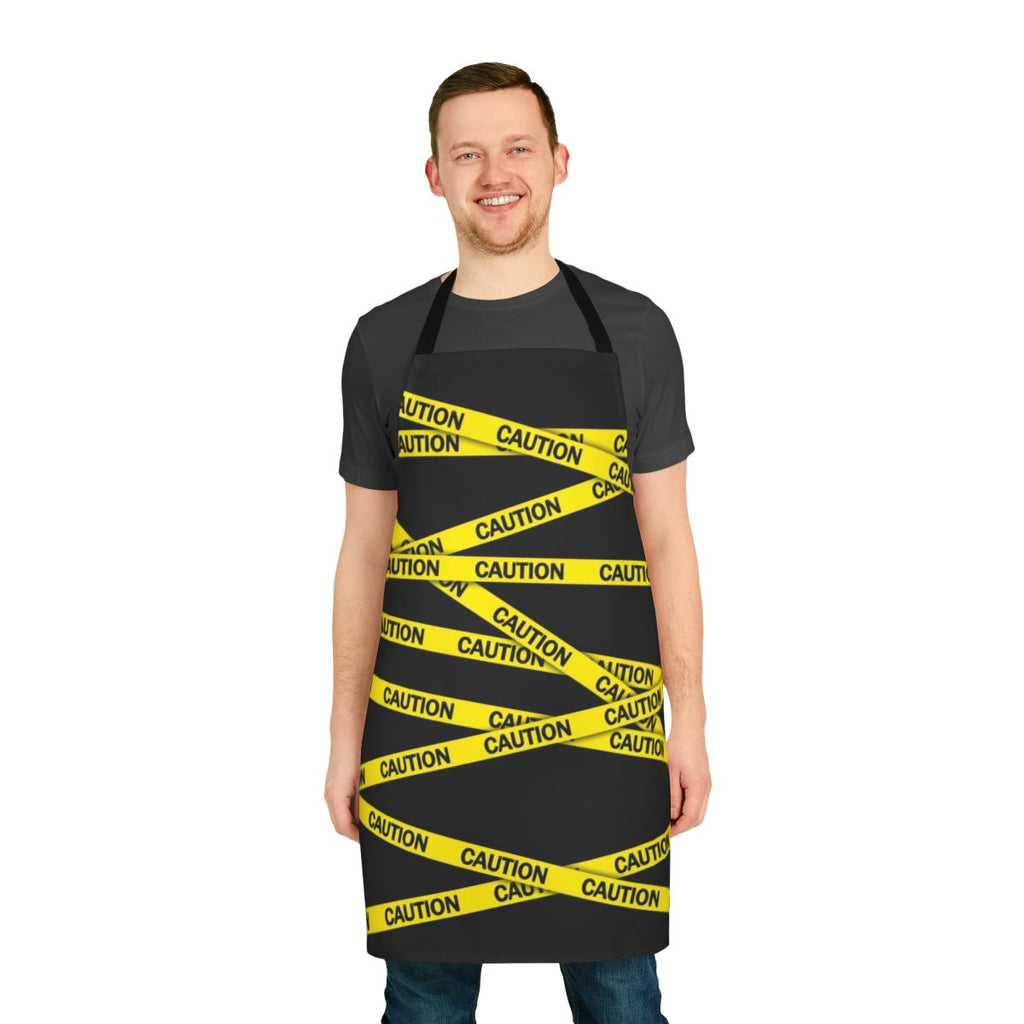 Bright yellow caution tape apron with bold warning design