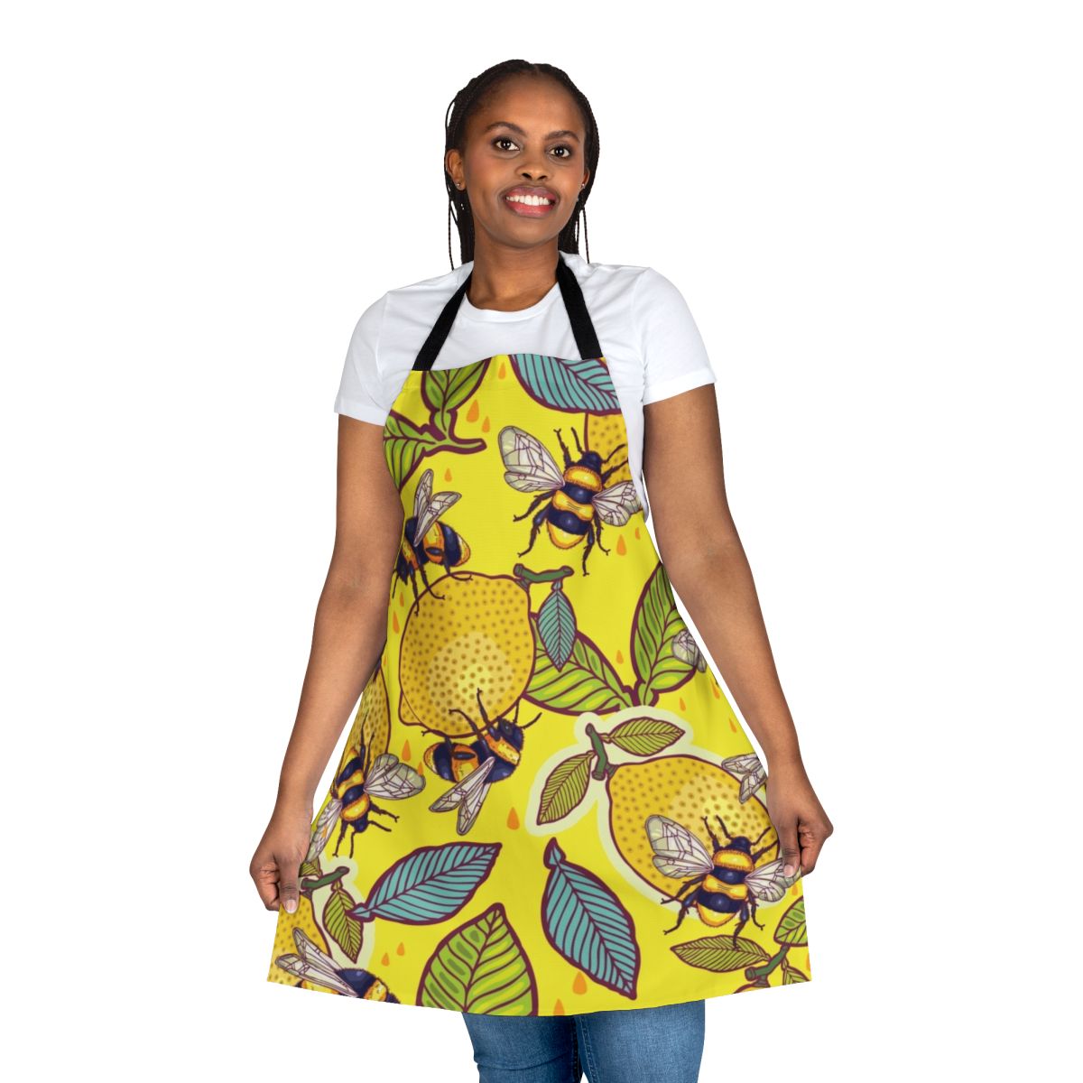 A vibrant yellow apron featuring a lemon and bee garden design