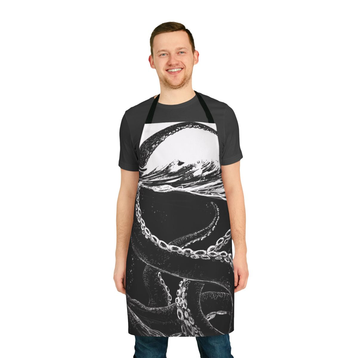 Black and white graphic of a giant kraken or sea monster with tentacles on a kitchen apron