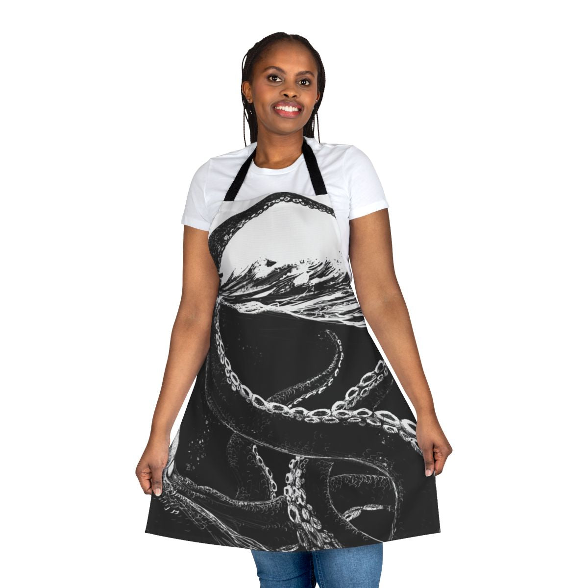 Black and white graphic of a giant kraken or sea monster with tentacles on a kitchen apron