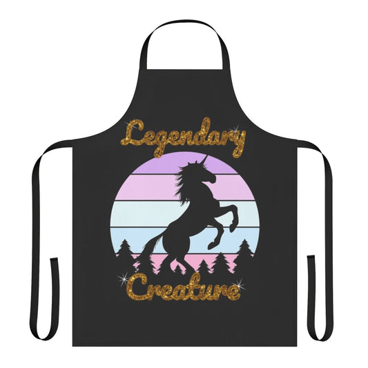 A white unicorn with a rainbow horn on a green foliage background, printed on a high-quality apron.