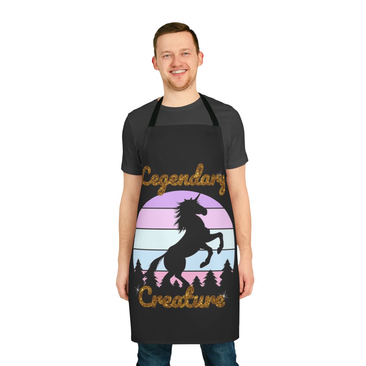 A white unicorn with a rainbow horn on a green foliage background, printed on a high-quality apron.