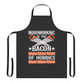Carpenter wearing a bacon-themed apron with pockets for tools