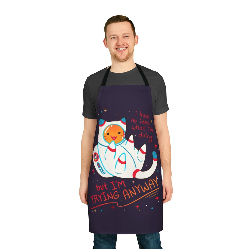 A stylish and inspirational apron featuring a cute cat astronaut design, perfect for cat lovers and space enthusiasts.