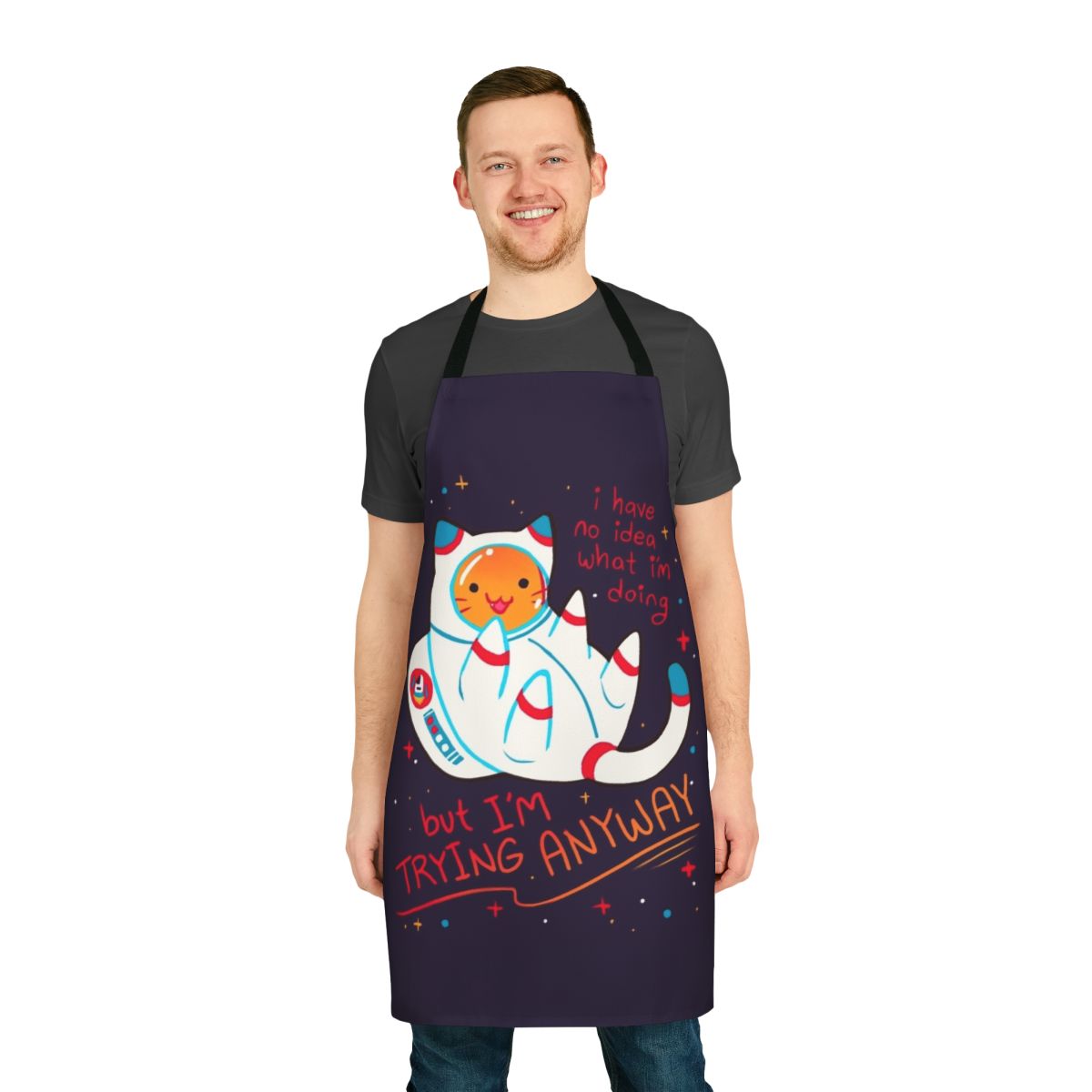 A stylish and inspirational apron featuring a cute cat astronaut design, perfect for cat lovers and space enthusiasts.