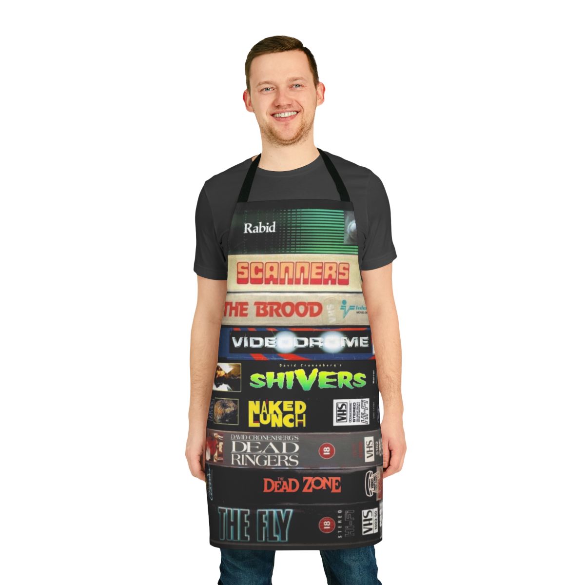 A vintage-style apron featuring the iconic VHS covers of Cronenberg's most beloved horror and sci-fi films.