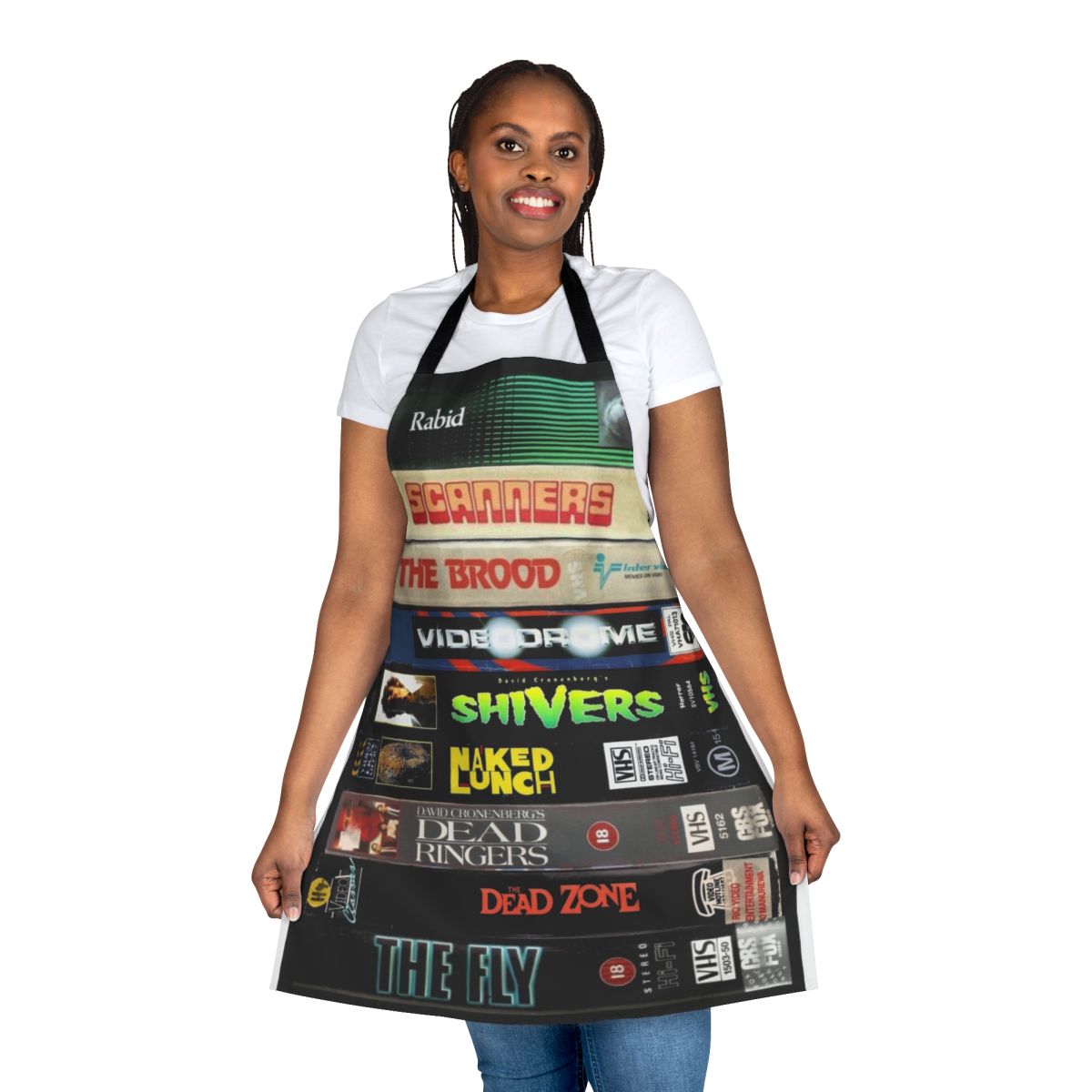 A vintage-style apron featuring the iconic VHS covers of Cronenberg's most beloved horror and sci-fi films.