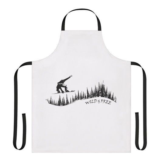 Snowboard enthusiast wearing a stylish apron featuring a snowboarding design in a winter forest setting