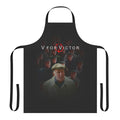 A black apron with the text "V For Victor" printed on it, inspired by the film "V for Vendetta" and the character Victor Meldrew from "One Foot in the Grave".