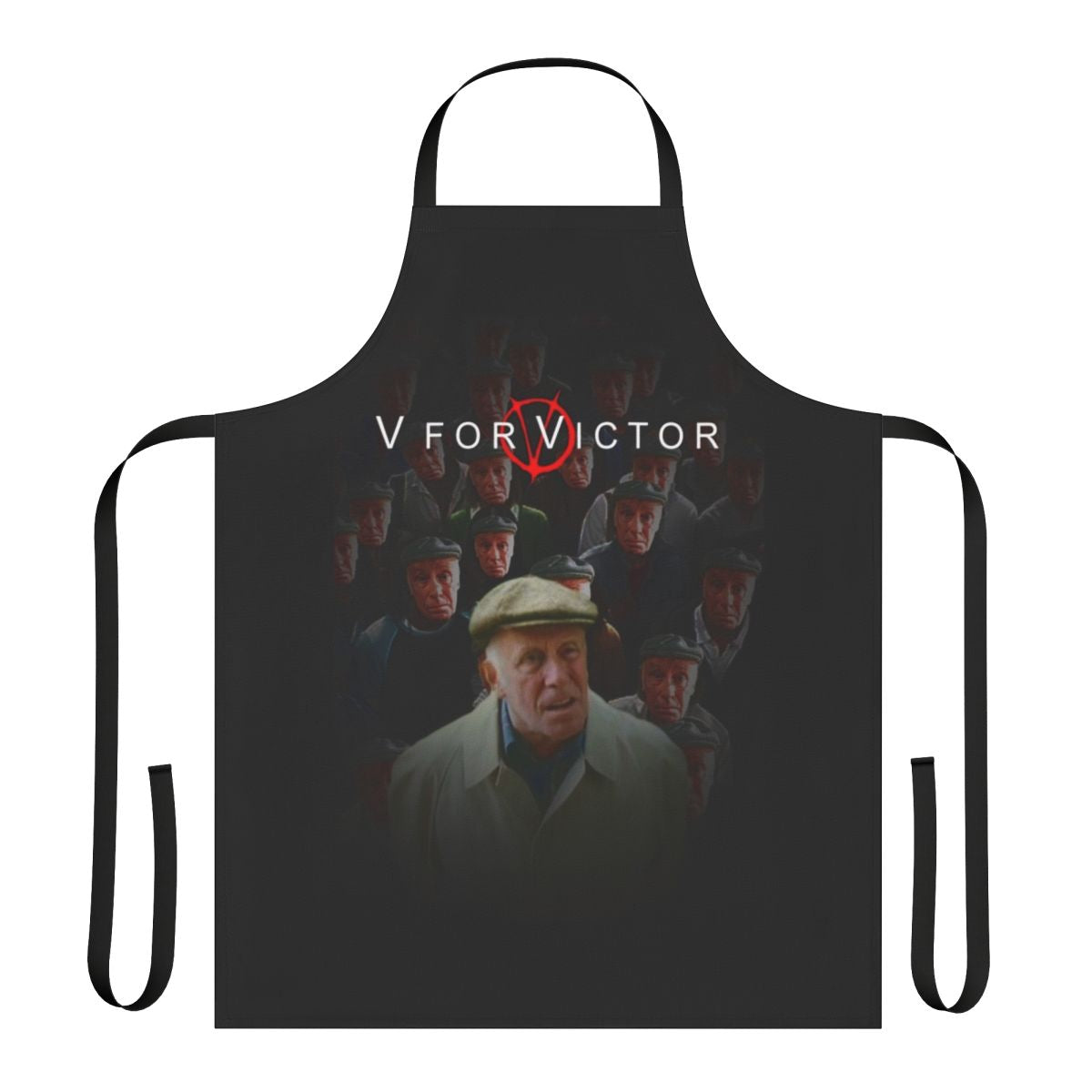 A black apron with the text "V For Victor" printed on it, inspired by the film "V for Vendetta" and the character Victor Meldrew from "One Foot in the Grave".