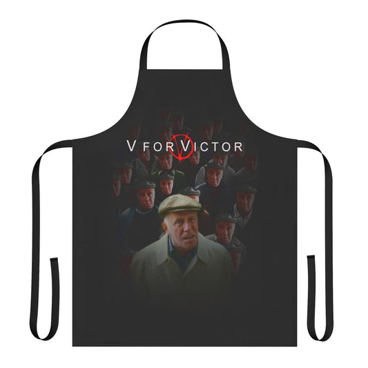 A black apron with the text "V For Victor" printed on it, inspired by the film "V for Vendetta" and the character Victor Meldrew from "One Foot in the Grave".