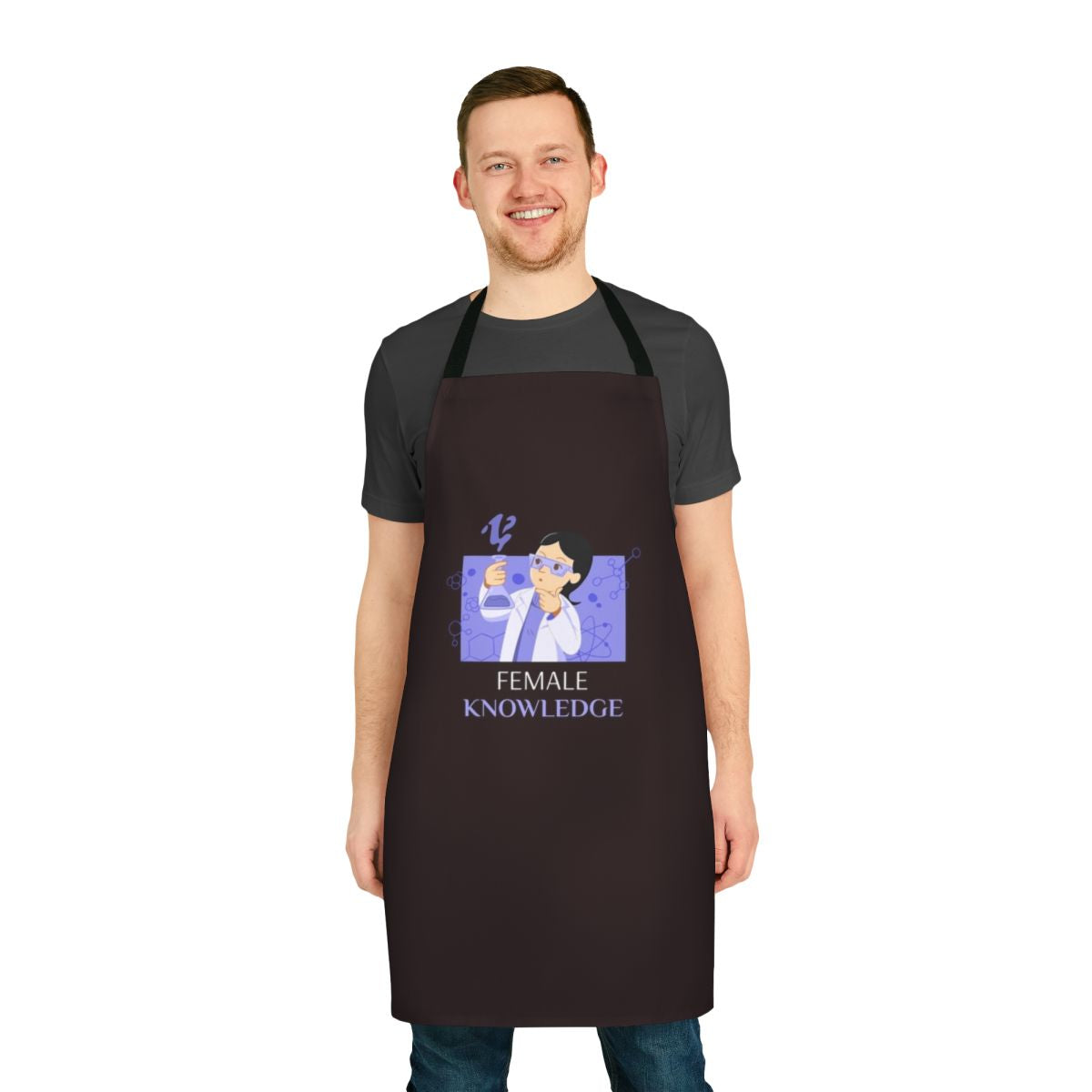 Woman wearing a black apron with a science-themed design, including a black cat, symbols, and the text "Female Knowledge Fun Science Apron".