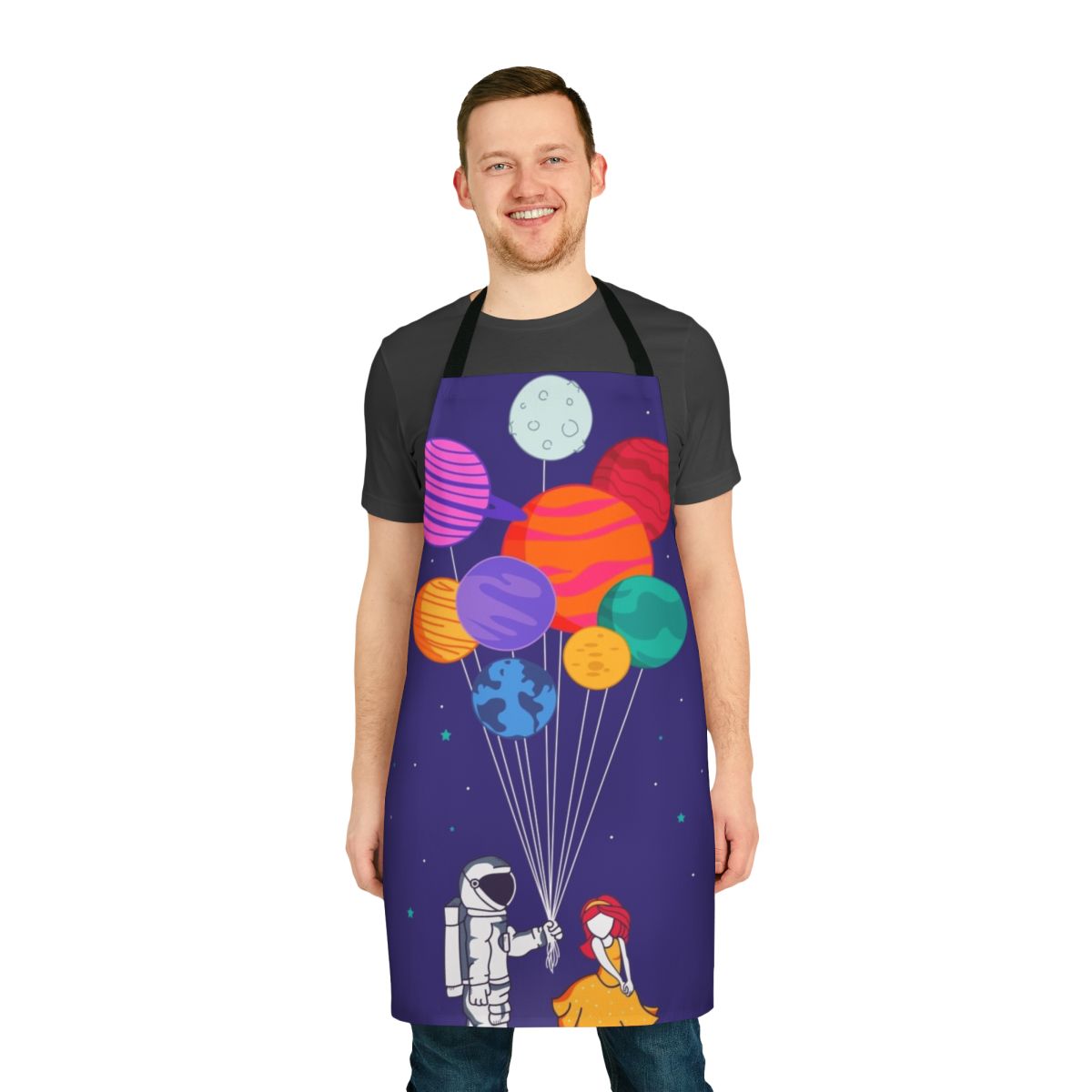 A colorful apron featuring an astronaut couple floating among the stars and planets of the solar system