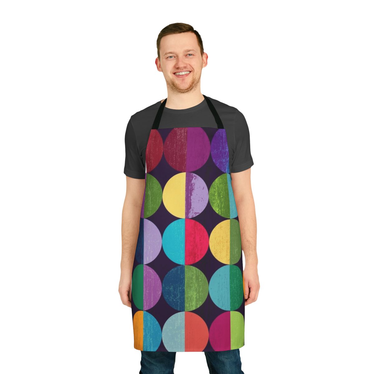 Geometric patterned apron featuring a moon design in shades of yellow, orange, blue, green, and pink.