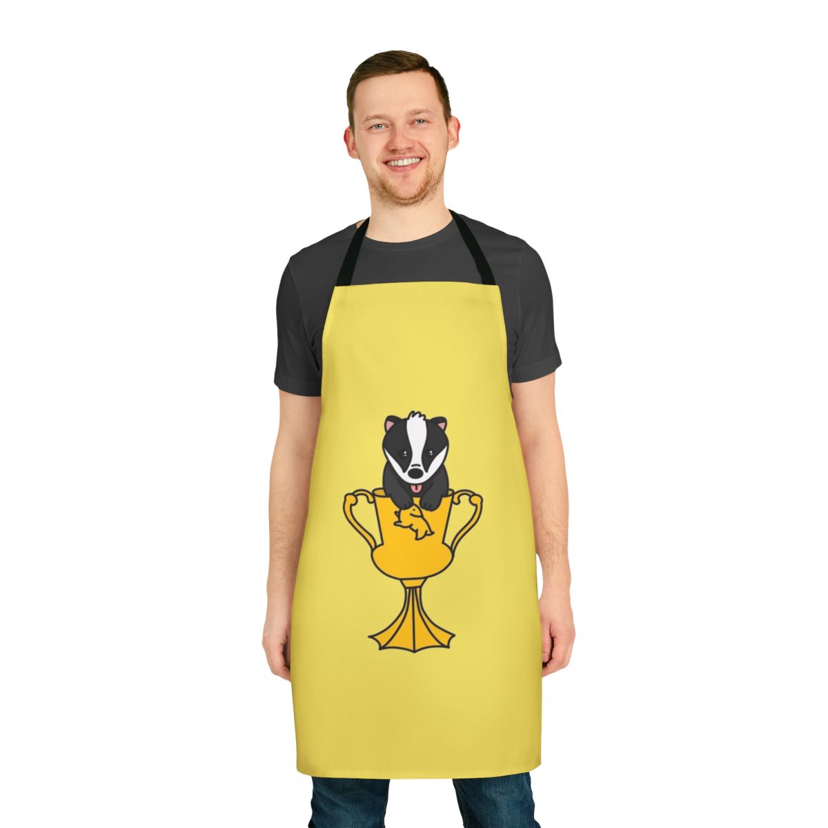 A whimsical apron featuring a cute, chibi-style baby badger design, perfect for Harry Potter fans and fantasy lovers.
