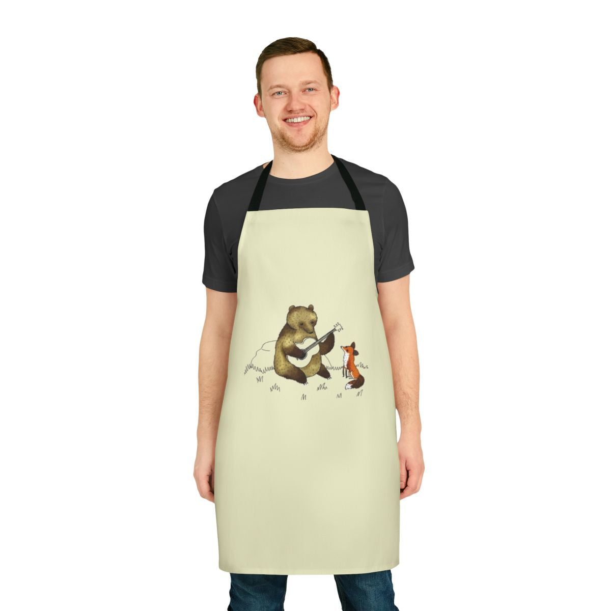 Illustration of a bear and fox playing music in a woodland scene, printed on a kitchen apron.