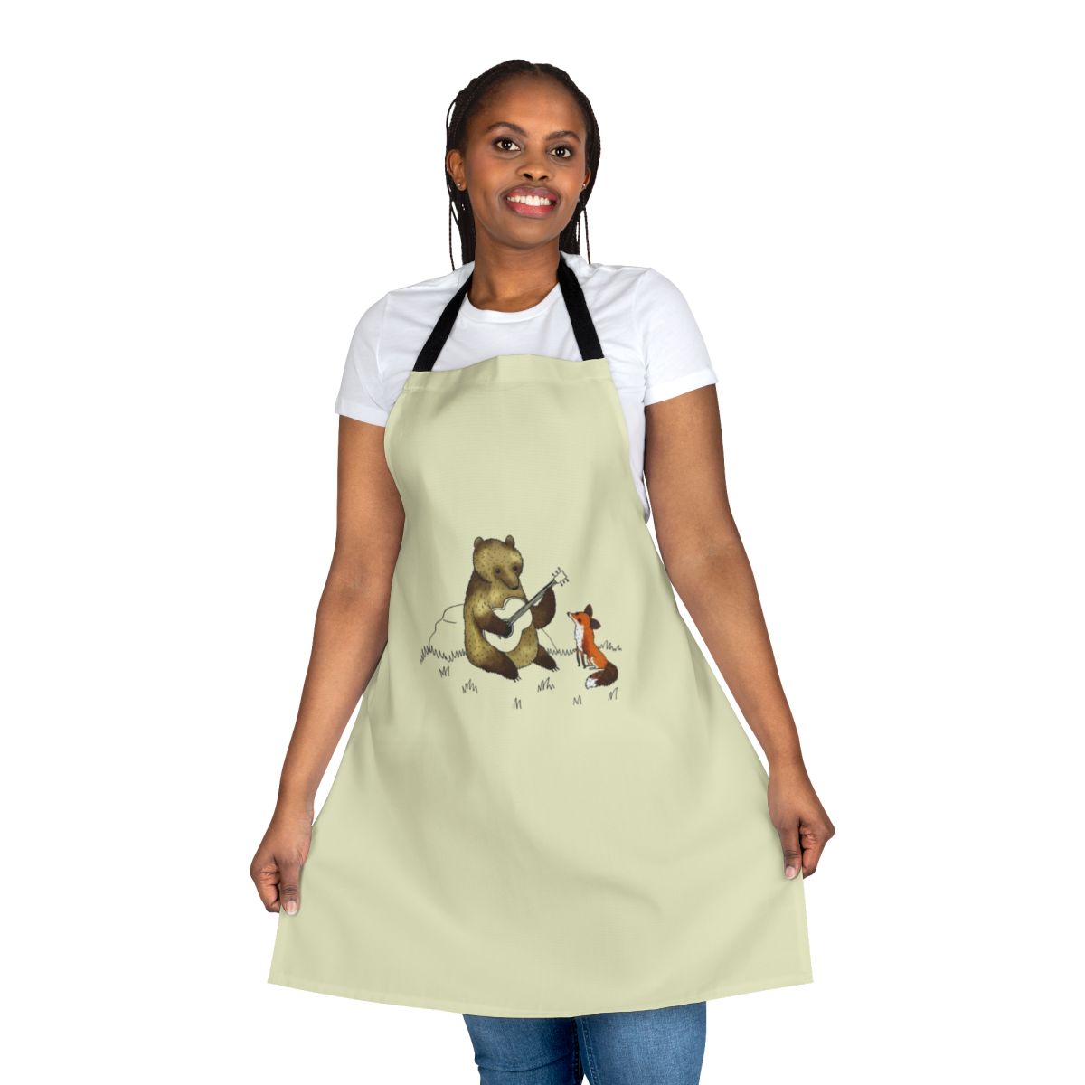 Illustration of a bear and fox playing music in a woodland scene, printed on a kitchen apron.