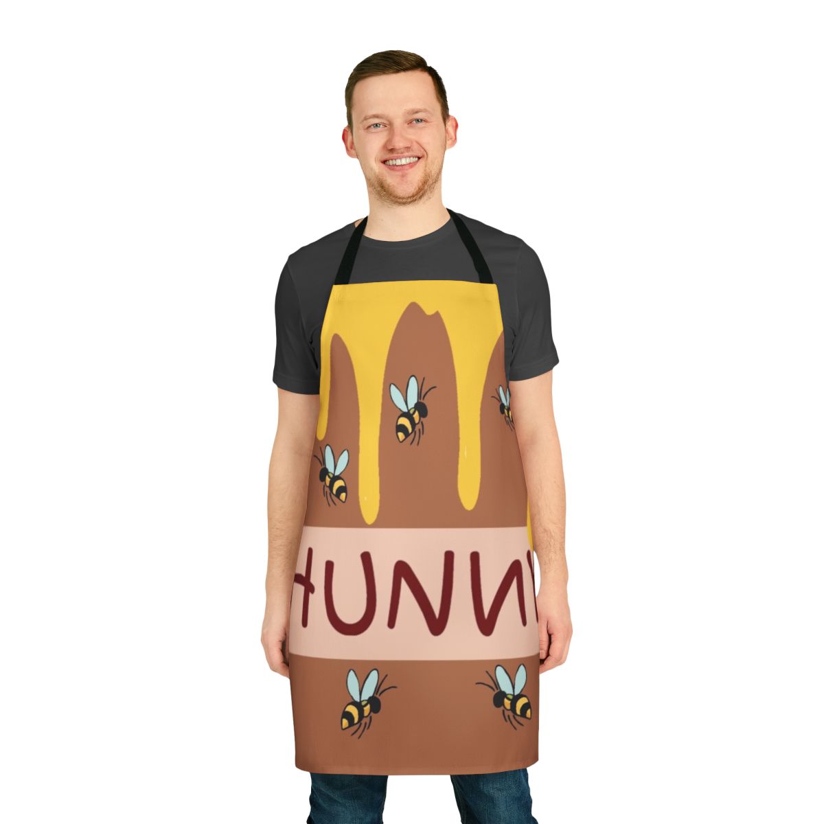 A colorful apron featuring a friendly honey bear cartoon character