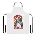 A retro-style apron featuring a colorful design with street cats and kittens