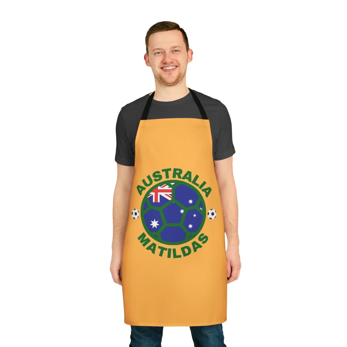 Green and yellow apron featuring the Matildas logo and Australia's national colors