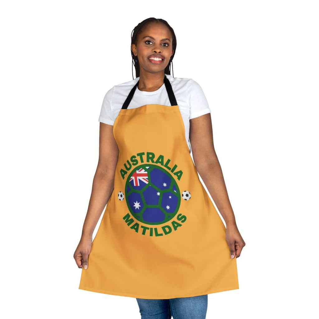 Green and yellow apron featuring the Matildas logo and Australia's national colors