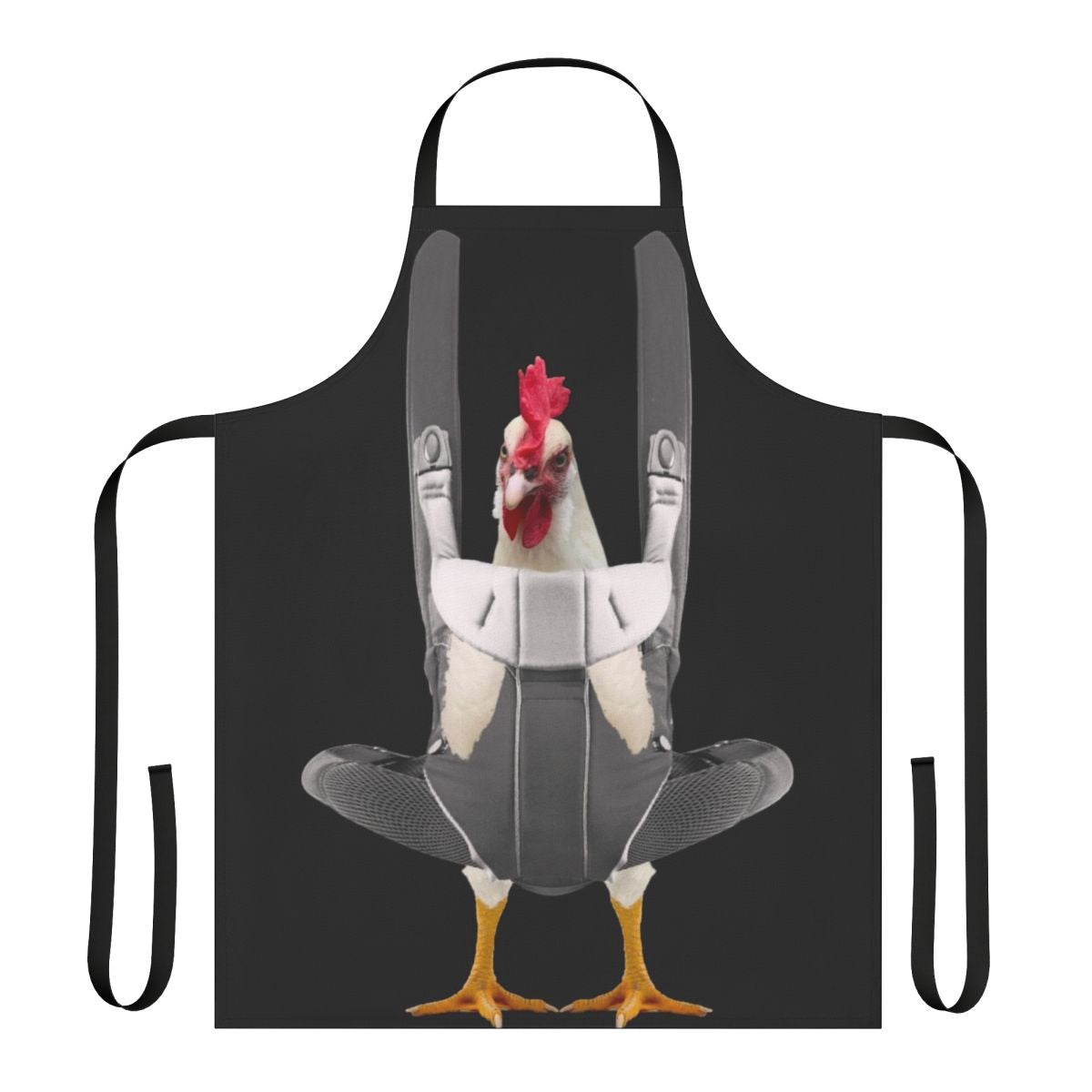 Person wearing an apron with a chicken design, carrying a chicken in a baby carrier