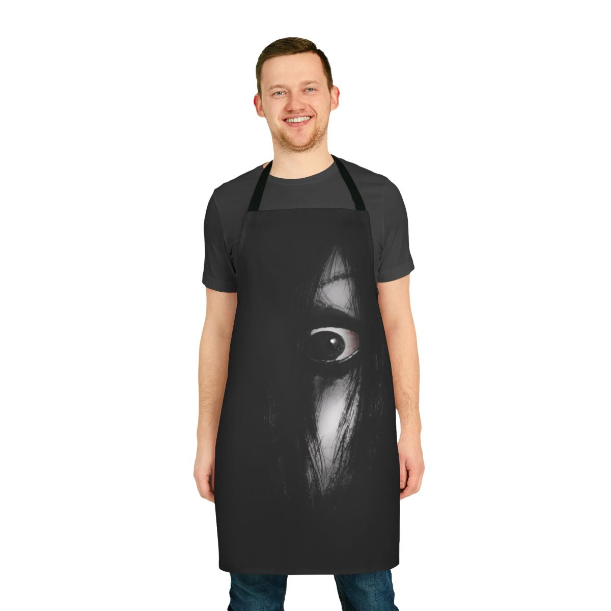A black apron featuring a creepy sketch design inspired by the Japanese horror movie "The Grudge".
