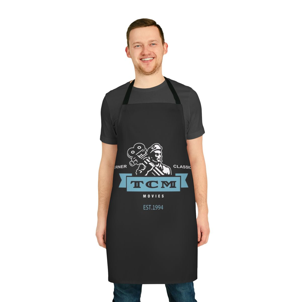 Stylish retro apron featuring the Turner Classic Movies logo and vintage movie design