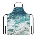 A blue and white apron featuring an abstract ocean wave pattern, perfect for the beach-loving home chef.