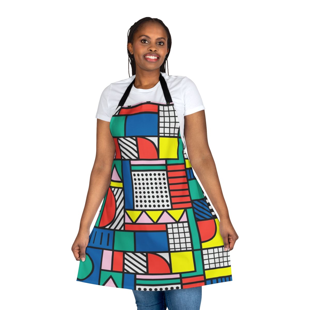 A vibrant, color block apron featuring a retro-inspired geometric pattern in shades of blue, pink, and yellow.