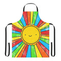 Colorful apron with a 'Radiate Positivity' design, featuring a sun, rainbow, and smiling faces.