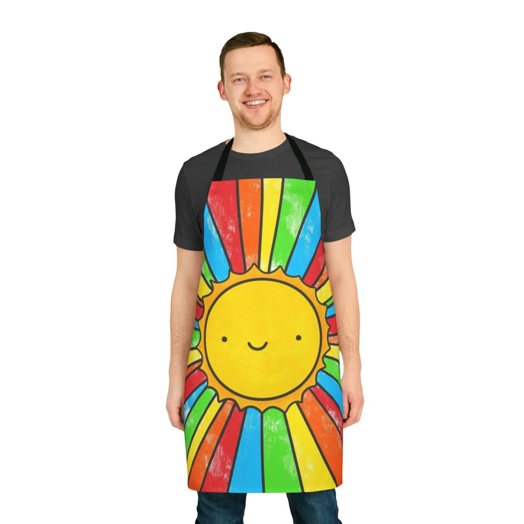 Colorful apron with a 'Radiate Positivity' design, featuring a sun, rainbow, and smiling faces.