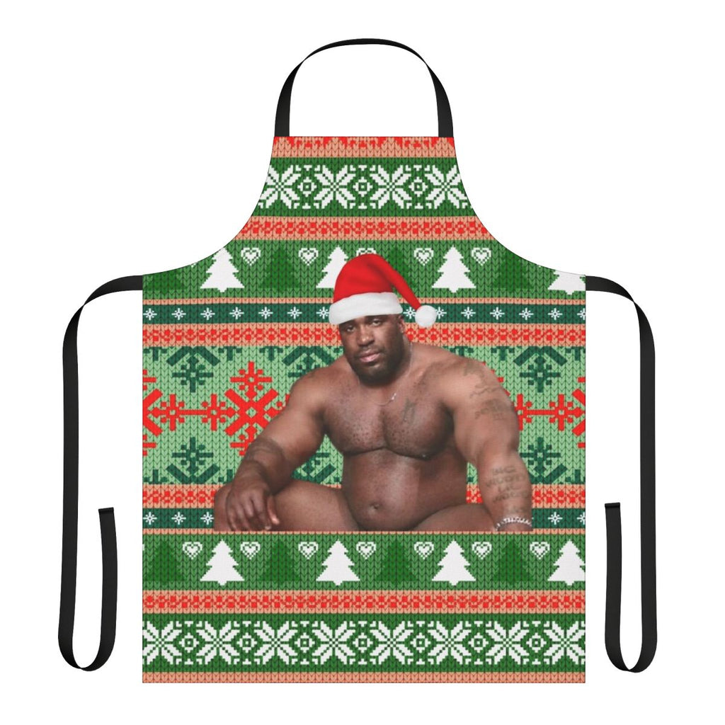 Barry Wood wearing a Christmas apron with festive holiday design