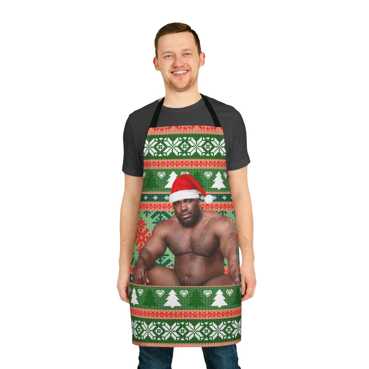 Barry Wood wearing a Christmas apron with festive holiday design