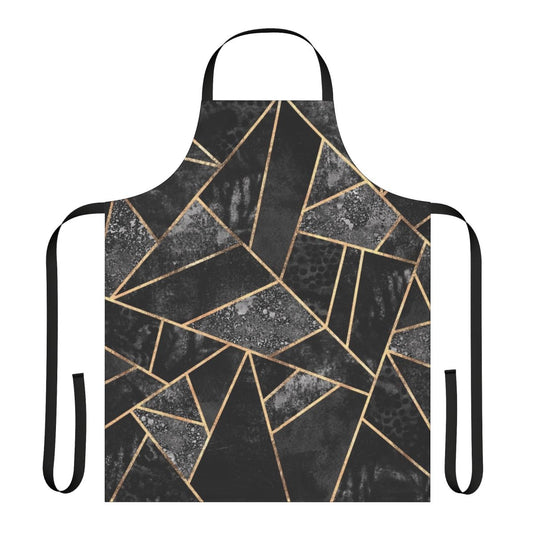 A black and gold abstract geometric patterned apron with a textured fabric design.