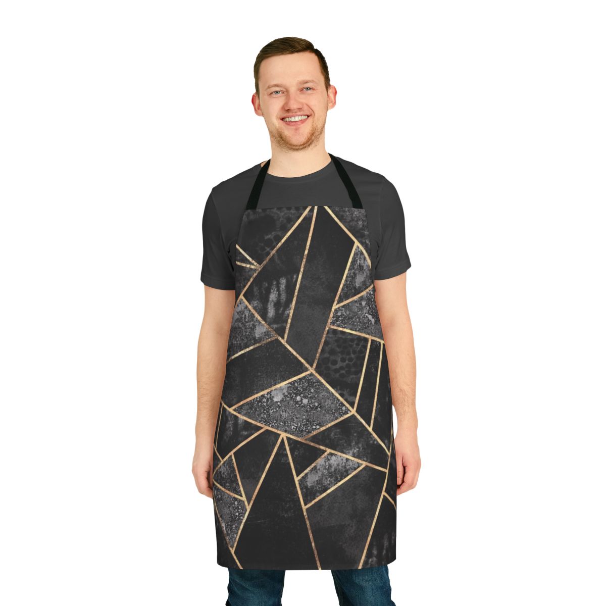 A black and gold abstract geometric patterned apron with a textured fabric design.
