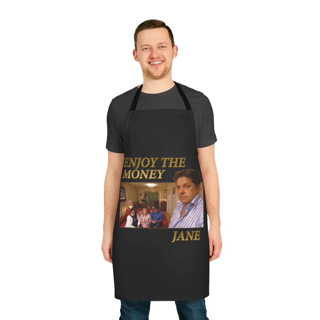 A white cooking apron with the text "Enjoy The Money Jane" printed on it.