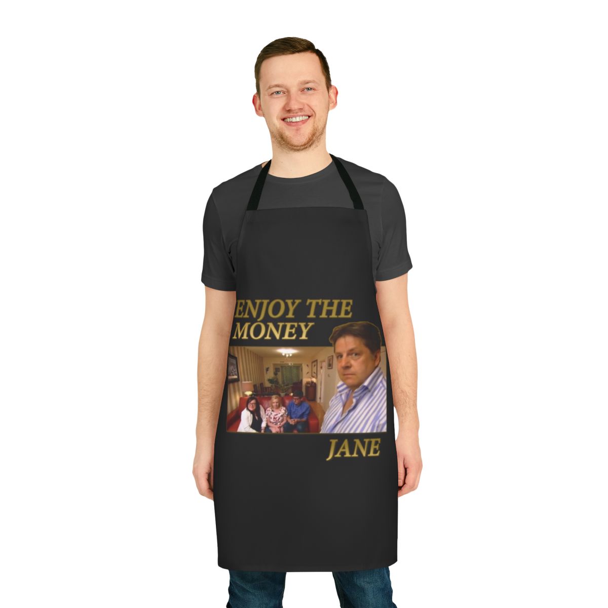 A white cooking apron with the text "Enjoy The Money Jane" printed on it.