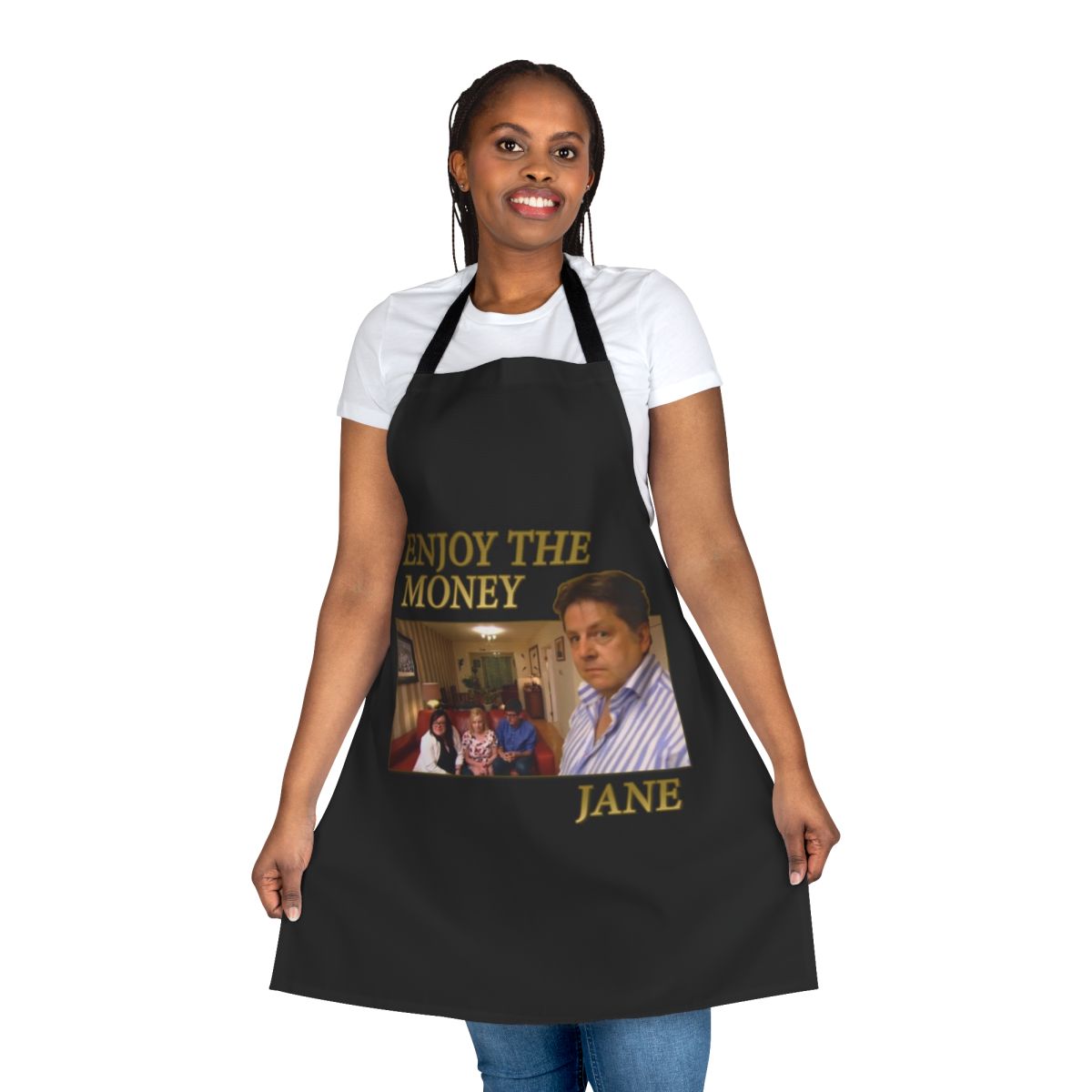 A white cooking apron with the text "Enjoy The Money Jane" printed on it.