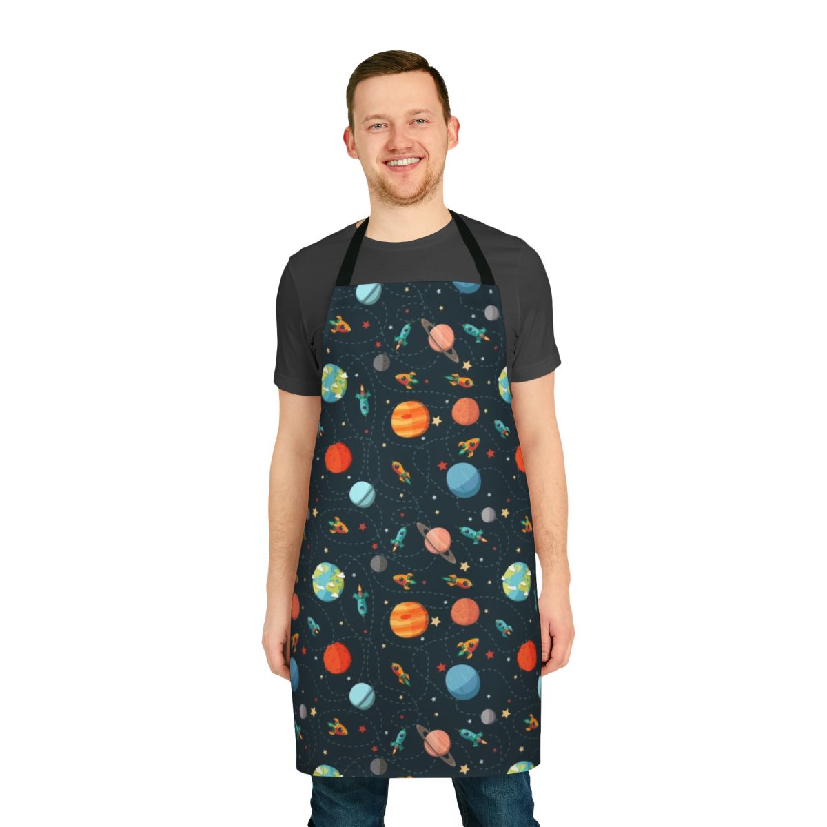 Colorful space-themed apron with cartoon planets, rockets, and astronauts