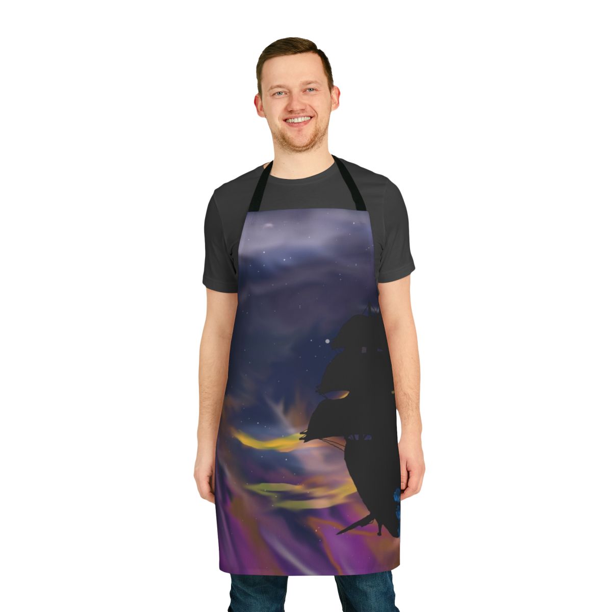 Apron featuring a silhouetted ship sailing through a starry galaxy