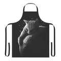 A stylish and whimsical black apron featuring a cat astronaut silhouette against a crescent moon and starry space backdrop