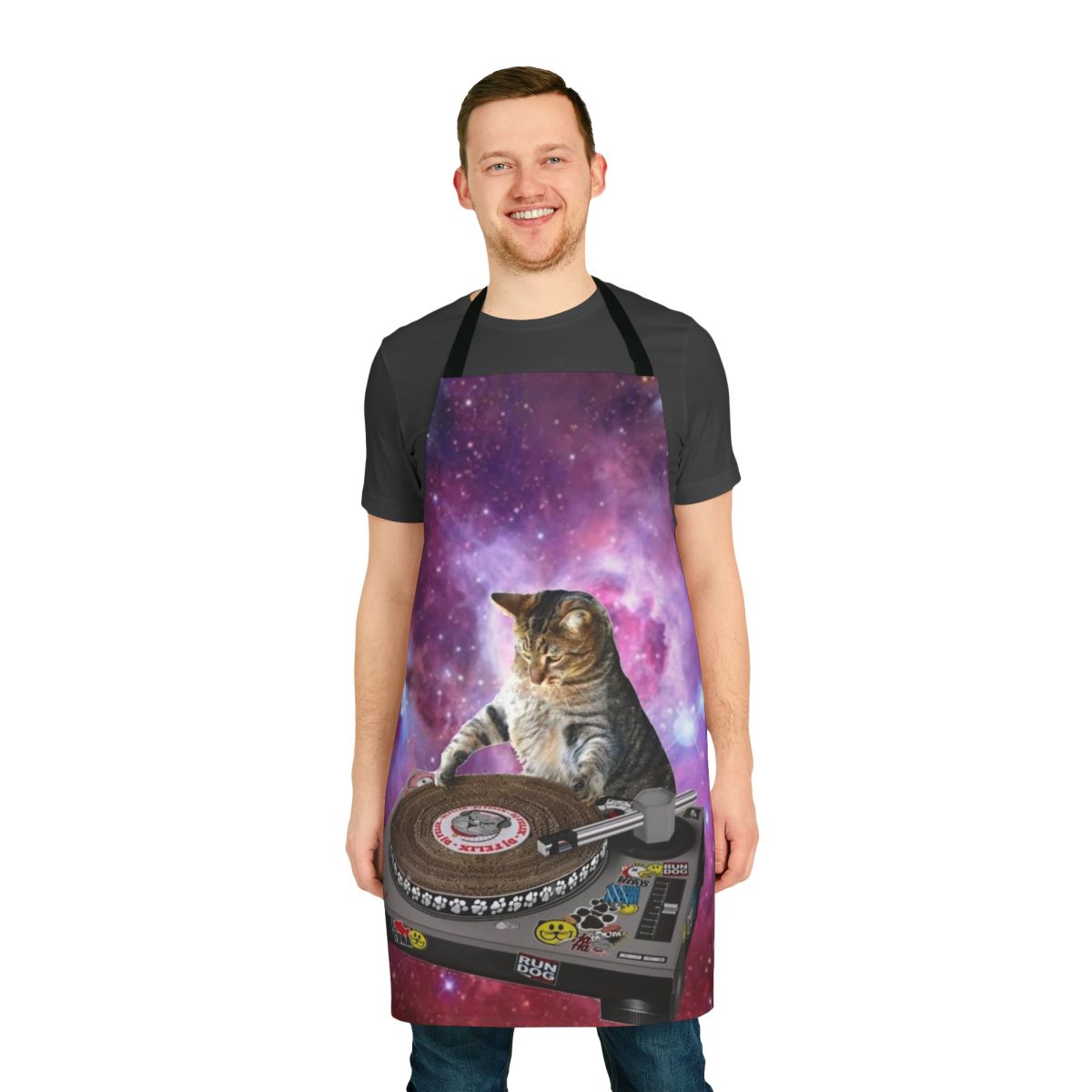 A vibrant, space-themed apron featuring a whimsical cat DJ design, perfect for kitchen or household use.