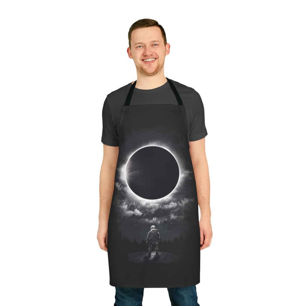 Cosmic Eclipse Apron featuring a dramatic black and white design with celestial elements like the moon, sun, and stars.