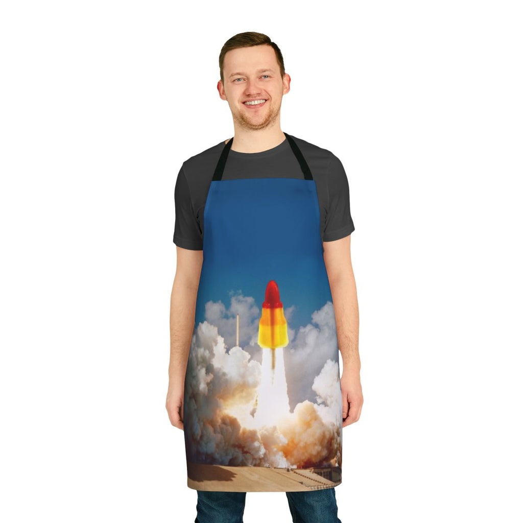 A vibrant apron featuring a retro-style rocket lolly design, perfect for space-themed kitchen decor.