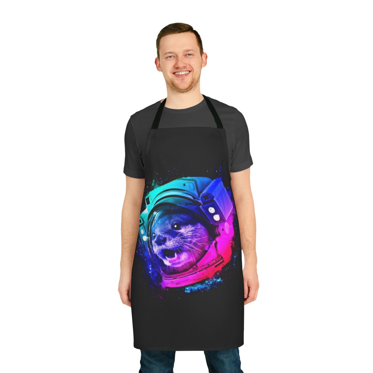 Whimsical apron featuring a sea otter in a space helmet surrounded by stars, galaxies, and rainbows